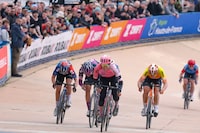 EF Education-TIBCO-SVB team's Canadian rider Alison Jackson (C) sprints to the finish line ahead of Liv Racing TeqFind team's Italian rider Katia Ragusa (2nd L), FDJ-Suez team's French rider Eugenie Duval (L), and St Michel-Mavic-Auber93 WE team's French rider Marion Borras (2nd R) during the third edition of the Paris-Roubaix one-day classic cycling race, between Denain and Roubaix, on April 8, 2023. (Photo by Thomas SAMSON / AFP) (Photo by THOMAS SAMSON/AFP via Getty Images)