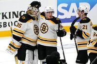 Boston Bruins goaltender Linus Ullmark (35) is congratulated by left wing Tomas Nosek (92) and right wing Garnet Hathaway (21) after Game 3 of an NHL hockey Stanley Cup first-round playoff series against the Florida Panthers, Friday, April 21, 2023, in Sunrise, Fla. (AP Photo/Lynne Sladky)