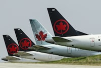 Grounded Air Canada planes sit on the tarmac at Pearson International Airport during in Toronto on Wednesday, April 28, 2021. THE CANADIAN PRESS/Nathan Denette