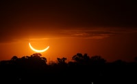 The moon passes in front of the setting sun during a total solar eclipse in Buenos Aires, Argentina, Tuesday, July 2, 2019.  Small towns and rural enclaves along the path of April’s 2024 total solar eclipse are steeling for huge crowds of sun chasers who plan to catch a glimpse of day turning into dusk in North America. (AP Photo/Marcos Brindicci, File)