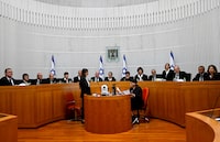 All 15 of Israel's Supreme Court justices appear for the first time in the country's history to look at the legality of Prime Minister Benjamin Netanyahu's contentious judicial overhaul, which the government pushed through parliament in July, in Jerusalem, Tuesday, Sept. 12, 2023. The divisive law, which cancels the court's ability to block government actions and appointments using the legal concept that they are "unreasonable," is the first piece of the wider government plan to weaken the Supreme Court. (Debbie Hill/Pool Photo via AP)