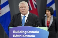 Ontario Premier Doug Ford, left, speaks during a press conference regarding housing development in the Greater Toronto Area, as Toronto Mayor Olivia Chow, right, looks on at Toronto City Hall, in Toronto on Thursday, Feb. 22, 2024. THE CANADIAN PRESS/Arlyn McAdorey