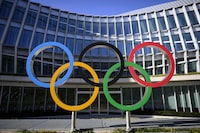 Olympic Rings are pictured in front of The Olympic House, headquarters of the International Olympic Committee (IOC) at the opening of the executive board meeting of the International Olympic Committee (IOC) in Lausanne, Switzerland, Tuesday, March 28, 2023. The International Olympic Committee (IOC) Executive Board is set to discuss the results of consultations regarding the status of athletes from Russia and Belarus in its meeting set to run until March 30. (Laurent Gillieron/Keystone via AP)