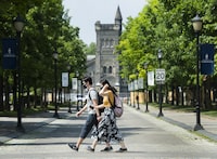 Students who receive scholarships get to spend more time focusing on school and less time working jobs to cover tuition and the cost of living. People walk past the University of Toronto campus in Toronto on Wednesday, June 10, 2020. THE CANADIAN PRESS/Nathan Denette