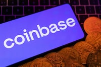 FILE PHOTO: A smartphone displaying a Coinbase logo and representation of cryptocurrencies are placed on a keyboard in this illustration taken, June 8, 2023. REUTERS/Dado Ruvic/Illustration/File Photo