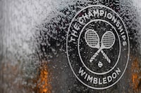 (FILES) In this file photo a water feature with the Wimbledon logo stands by the members area at the All England Tennis Club in Wimbledon, southwest London, on July 1, 2018, on the eve of the 2018 Wimbledon Championships tennis tournament. - Roger Federer and Serena Williams were among the tennis stars left devastated on Wednesday as Wimbledon was cancelled for the first time since World War II due to the coronavirus.
The cancellation of the oldest Grand Slam tournament at London's All England Club leaves the season in disarray, with no tennis set to be played until mid-July. (Photo by Ben STANSALL / AFP) / RESTRICTED TO EDITORIAL USE (Photo by BEN STANSALL/AFP via Getty Images)