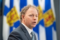 Finance and Treasury Board Minister Allan MacMaster speaks to reporters before tabling the provincial budget at the Nova Scotia legislature in Halifax, Thursday, Feb. 29, 2024. THE CANADIAN PRESS/Darren Calabrese