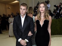 FILE - Justin Bieber, left, and Hailey Bieber attend The Metropolitan Museum of Art's Costume Institute benefit gala on Sept. 13, 2021, in New York. Justin Bieber and wife Hailey are expecting their first child together. (Photo by Evan Agostini/Invision/AP, File)