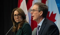 Deputy Governor Carolyn Rogers looks on as Bank of Canada Governor Tiff Macklem speaks during a news conference following a rate announcement, Wednesday, April 10, 2024 in Ottawa.  THE CANADIAN PRESS/Adrian Wyld