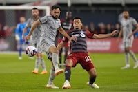 Toronto FC's Brandon Servania (right) makes a pass past CF Montreal's Mathieu Choiniere  during second half Canadian Championship quarterfinal soccer action in Toronto on Tuesday, May 9, 2023.THE CANADIAN PRESS/Chris Young