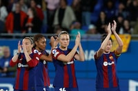 Barcelona's players applaud supporters at the end of the women's Champions League quarterfinals, second leg, soccer match between FC Barcelona and SK Brann Kvinner at the Estadi Johan Cruyff in Barcelona, Spain, Thursday, March 28, 2024. (AP Photo/Joan Monfort)