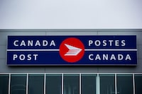The Canada Post logo is seen on the outside the company's Pacific Processing Centre, in Richmond, B.C., on June 1, 2017. THE CANADIAN PRESS/Darryl Dyck