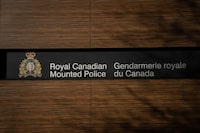 The B.C. RCMP Divisional Headquarters is seen, in Surrey, B.C., on Thursday, Jan. 11, 2024. The first police officer to enter a room where a woman was being held hostage in 2019 has told a B.C. coroner's inquest that he saw her lying on a bed on top of her captor, who was holding a knife to her throat with a gun in his other hand. THE CANADIAN PRESS/Ethan Cairns