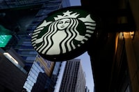 FILE PHOTO: A Starbucks sign is shown on one of the company's stores in Los Angeles, California, U.S. October 19, 2018.  REUTERS/Mike Blake/File Photo  GLOBAL BUSINESS WEEK AHEAD/File Photo