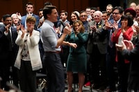 Deputy Prime Minister and Minister of Finance Chrystia Freeland, back middle, applauds as Prime Minister Justin Trudeau delivers a speech  to his caucus during a meeting on Parliament Hill  in Ottawa on Wednesday, April 17, 2024.  THE CANADIAN PRESS/Sean Kilpatrick

