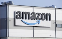 An Amazon company logo is seen on the facade of a company's building in Schoenefeld near Berlin, Germany, on March 18, 2022. Unifor says it’s temporarily withdrawing its applications to represent workers at two Vancouver-area Amazon centres, accusing the digital retail giant of providing a “suspiciously high” employee count. THE CANADIAN PRESS/AP, Michael Sohn