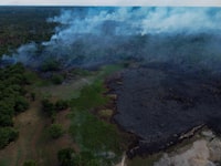 Aerial view of a fire in the Amazon rainforest in Iranduba, Amazonas, northern Brazil, on September 23, 2023. The Amazonas is suffering a severe drought that is affecting navigation and the distribution of fuel and food to the interior, following which the government of Amazonas declared a State of Environmental Emergency on September 12. (Photo by Michael Dantas / AFP) (Photo by MICHAEL DANTAS/AFP via Getty Images)