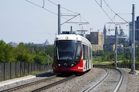An Ottawa Light Rail Transit (OLRT) train travels along the tracks in Ottawa on Wednesday, June 22, 2022. Ottawa's light-rail transit service has been partially reopened for service after a three-week shutdown. THE CANADIAN PRESS/Sean Kilpatrick