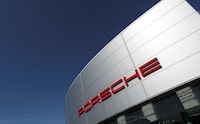 A logo of Porsche is seen outside a Porsche car dealer, amid the coronavirus disease (COVID-19) outbreak in Brussels, Belgium May 28, 2020. REUTERS/Yves Herman