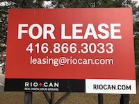 RioCan signage is shown at a strip mall in Mississauga, Ont., Saturday, Oct.24, 2020.&nbsp;RioCan Real Estate Investment Trust says millions of fair value losses left the company with a net loss of $73.5 million in its most recent quarter. THE&nbsp;CANADIAN PRESS/Richard Buchan