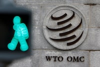 FILE PHOTO: The  World Trade Organization (WTO) logo is pictured in front of their headquarters in Geneva, Switzerland, October 28, 2020. REUTERS/Denis Balibouse/File Photo
