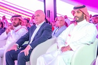 This handout picture provided by the Saudi press Agency (SPA) on October 23, 2023 shows Saudi Crown Prince Mohammed bin Salman MBS (R) and FIFA President Gianni Infantino (C) attending the launch of the Esports World Cup in Riyadh. Saudi Arabia said on October 23 it would organise an eSports World Cup starting next year, the latest boost to a sector Riyadh hopes will create tens of thousands of local jobs. (Photo by SPA / AFP) / === RESTRICTED TO EDITORIAL USE - MANDATORY CREDIT "AFP PHOTO / HO / SPA" - NO MARKETING NO ADVERTISING CAMPAIGNS - DISTRIBUTED AS A SERVICE TO CLIENTS === (Photo by -/SPA/AFP via Getty Images)