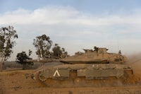 SOUTHERN ISRAEL, ISRAEL - MAY 2: An Israeli tank moves near the border with the Gaza Strip on May 2, 2024 in Southern Israel, Israel. The country's Prime Minister Benjamin Netanyahu has vowed that Israel will conduct a Rafah offensive whether or not there's a temporary ceasefire deal with Hamas. The US secretary of state visited Israel this week and touted the latest version of a ceasefire proposal, which was being presented for Hamas's consideration. The US also cautioned Israeli leaders that an offensive in Rafah would risk a deal to free the Israeli hostages being held in Gaza.(Photo by Amir Levy/Getty Images)