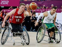 Canada's Patrick Anderson, left, dribbles the ball during the men's wheelchair basketball final game at the 2012 Paralympics in London on September 8, 2012. Patrick Anderson's music career will have to wait. The three-time Paralympic gold medallist has returned to Canada's wheelchair basketball team, hoping to help Canada climb the medal podium at the world championships. The 39-year-old from Fergus, Ont., who lost his legs in a car accident at the age of nine, helped Canada win gold at the 2000, 2004, and 2012 Paralympics, plus silver in 2008, but he left the sport after the 2012 London Games to pursue a music career. He and wife Anna Paddock make up the musical duo The Lay Awakes. THE CANADIAN PRESS/AP, Lefteris Pitarakis