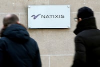FILE PHOTO: People walk past the logo of French bank Natixis at one of their office in Paris February 18, 2013.   REUTERS/Charles Platiau/File Photo                     GLOBAL BUSINESS WEEK AHEAD