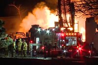 In this frame grab taken from video provided by WXYZ, firefighters battle an industrial fire in the Detroit suburb of Clinton Township, late Monday, March 4, 2024. (Courtesy of WXYZ via AP)