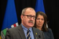 The Alberta government is making changes to a bill that gives cabinet unfettered power to fire mayors and councillors and overturn local bylaws. Minister of Municipal Affairs Ric McIver and Alberta Premier Danielle Smith introduce legislation in Edmonton, Wednesday, April 10, 2024. THE CANADIAN PRESS/Jason Franson