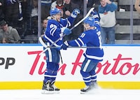Feb 15, 2024; Toronto, Ontario, CAN; Toronto Maple Leafs right wing William Nylander (88) scores the winning goal and celebrates with center Max Domi (11) against the Philadelphia Flyers during the overtime period at Scotiabank Arena. Mandatory Credit: Nick Turchiaro-USA TODAY Sports