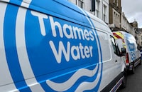 FILE PHOTO: Thames Water vans are parked on a road as repair and maintenance work takes place, in London, Britain, April 3, 2024. REUTERS/Toby Melville/File Photo