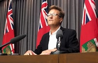 Manitoba Progressive Conservative legislature members have met for the first time since last week's election that saw them go from government to Opposition. Caucus chair Ron Schuler says he fully supports party leader Heather Stefanson's decision to stay on as leader until a successor is chosen. Schuler speaks to media in Winnipeg on Thursday, July 26, 2018. THE CANADIAN PRESS/Steve Lambert