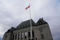 The flag of the Supreme Court of Canada flies on the east flag pole as the court welcomes their newest justice Michelle O'Bonsawin in Ottawa, on Monday, Nov. 28, 2022. O'Bonsawin is the first Indigenous judge to be appointed to the Supreme Court of Canada. THE CANADIAN PRESS/Sean Kilpatrick