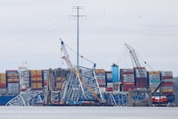 Wreckage of the Francis Scott Key bridge lies across the deck of the Dali cargo vessel as salvage work continues, in Baltimore, Maryland, U.S., April 1, 2024. REUTERS/Julia Nikhinson