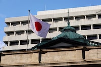 The national flag flutters at the Bank of Japan headquarters in Tokyo on January 23, 2024. (Photo by Kazuhiro NOGI / AFP) (Photo by KAZUHIRO NOGI/AFP via Getty Images)