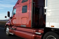 File #: 11720887
Truck on the highway.
Credit:  iStockphoto

(Royalty-Free)

Keywords: 	Truck, Semi-Truck, Car Transporter, Trucking, Highway, Tire, Red, Speed, Road, Loading, Vehicle Trailer