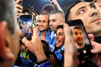 Napoli fans celebrate with Napoli's Slovakian midfielder Stanislav Lobotka (C-L) after the Italian Serie A football match between Udinese and Napoli on May 4, 2023 at the Friuli stadium in Udine. - Napoli ended a 33-year wait to win Italy's Serie A on May 4 after a 1-1 draw at Udinese secured their third league title and emulated the great teams led by Diego Maradona. (Photo by Tiziana FABI / AFP) (Photo by TIZIANA FABI/AFP via Getty Images) *** BESTPIX ***