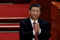 FILE PHOTO: Chinese President Xi Jinping applauds at the closing session of the National People's Congress (NPC) at the Great Hall of the People in Beijing, China March 11, 2024. REUTERS/Tingshu Wang/File Photo