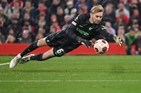 Liverpool's Irish goalkeeper #62 Caoimhin Kelleher dives to cover a wide ball during the UEFA Europa League group E football match between Liverpool and Toulouse at Anfield in Liverpool, north west England on October 26, 2023. Liverpool won the match 5-1. (Photo by Oli SCARFF / AFP) (Photo by OLI SCARFF/AFP via Getty Images)