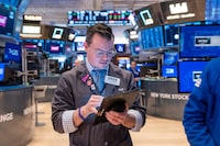 Traders work on the floor of the New York Stock Exchange (NYSE) on April 5.