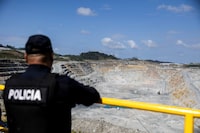 FILE PHOTO: A police officer operates at Cobre Panama mine of Canadian First Quantum Minerals, one of the world's largest open-pit copper mines, which was forced to shut down after Panama's top court ruled that its contract was unconstitutional following nationwide protests opposed to its continued operation, during a media tour, in Donoso, Panama, January 11, 2024. REUTERS/Tarina Rodriguez/File Photo