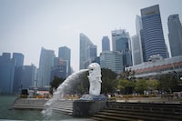 FILE - The Merlion statue spouts water at a park with the background of a business district in Singapore, on Sept. 21, 2019. Singapore hanged a third prisoner in two weeks on Thursday, Aug. 3, 2023, for drug trafficking despite calls for the city-state to halt capital punishment for drug-related crimes. (AP Photo/Vincent Thian, File)