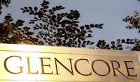 File photo: The logo of commodities trader Glencore is pictured in front of the company's headquarters in Baar, Switzerland, July 18, 2017.  REUTERS/Arnd Wiegmann/File photo
