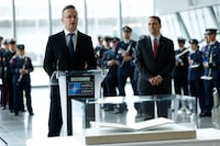 Hungary's Foreign Minister Peter Szijjarto, center, addresses the audience as he stands behind the original Washington Treaty during a ceremony to mark the 75th anniversary of NATO at NATO headquarters in Brussels, Thursday, April 4, 2024. NATO marked on Thursday 75 years of collective defense across Europe and North America, with its top diplomats vowing to stay the course in Ukraine as better armed Russian troops assert control on the battlefield. (AP Photo/Geert Vanden Wijngaert)