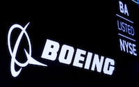 FILE PHOTO: The Boeing logo is displayed on a screen, at the New York Stock Exchange (NYSE) in New York, U.S., August 7, 2019. REUTERS/Brendan McDermid/File Photo