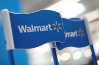 FILE PHOTO: Walmart signs are displayed inside a Walmart store in Mexico City, Mexico March 28, 2019. Picture taken March 28, 2019. REUTERS/Edgard Garrido/File Photo
