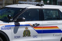 A Surrey RCMP officer drives a police vehicle in Surrey, B.C., on Friday, April 28, 2023. RCMP in Metro Vancouver say one person is dead and three people have been arrested after a hit-and-run early this morning. THE CANADIAN PRESS/Darryl Dyck