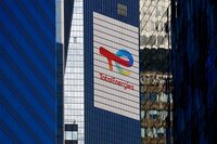 FILE PHOTO: FILE PHOTO: The logo of French oil and gas company TotalEnergies is seen at the company's headquarters skyscraper in the financial and business district of La Defense, near Paris, France September 14, 2023. REUTERS/Gonzalo Fuentes/File Photo/File Photo